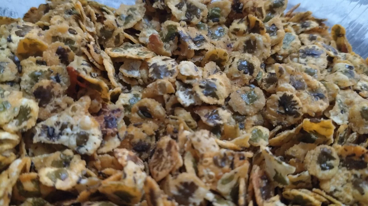 Flattened spiced green moong jor flakes.